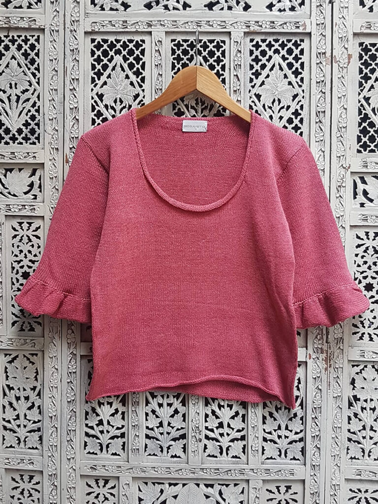 Sweater BARN rosa presentado en percha